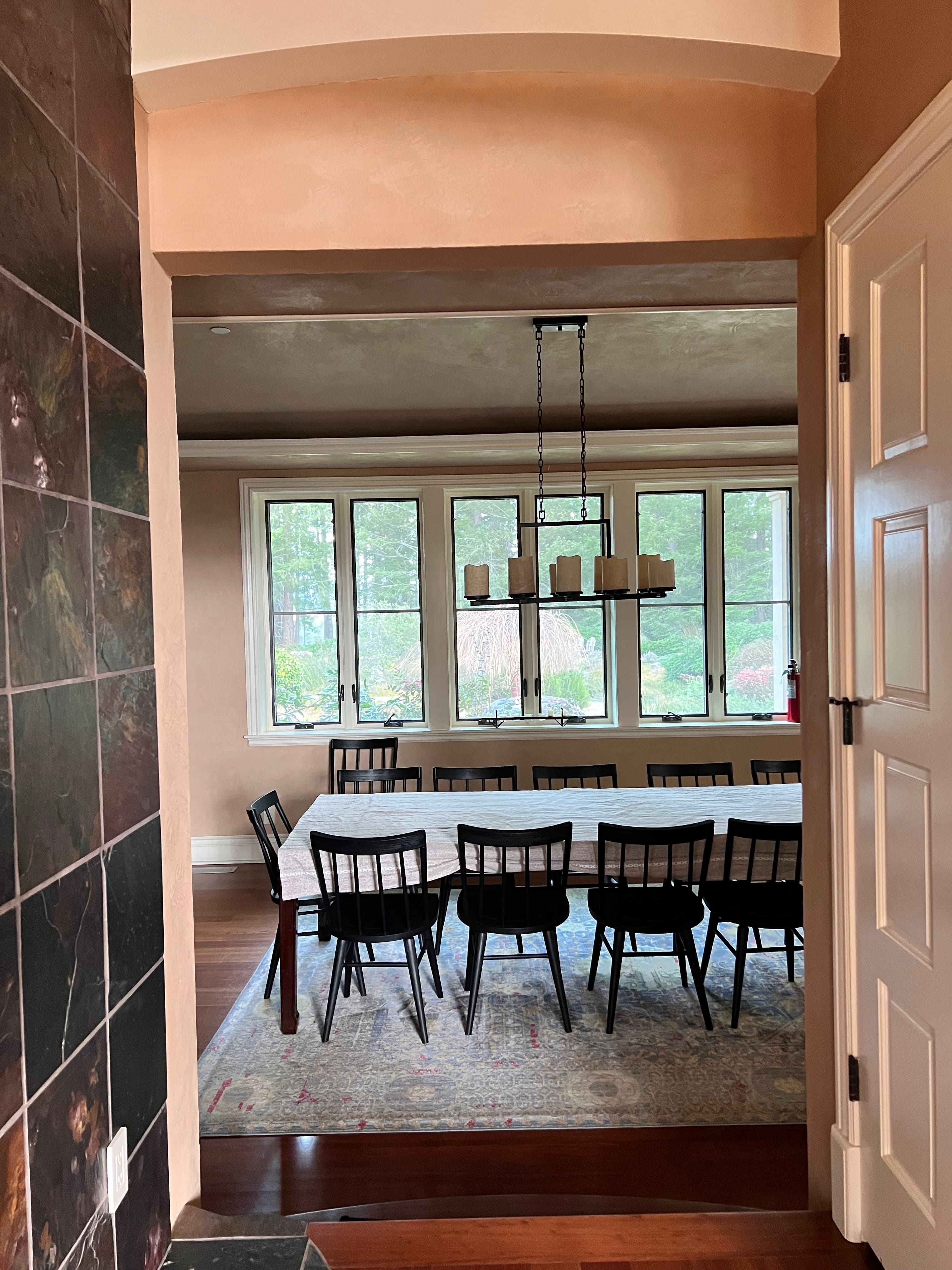 Wide view of dining room with plaster walls